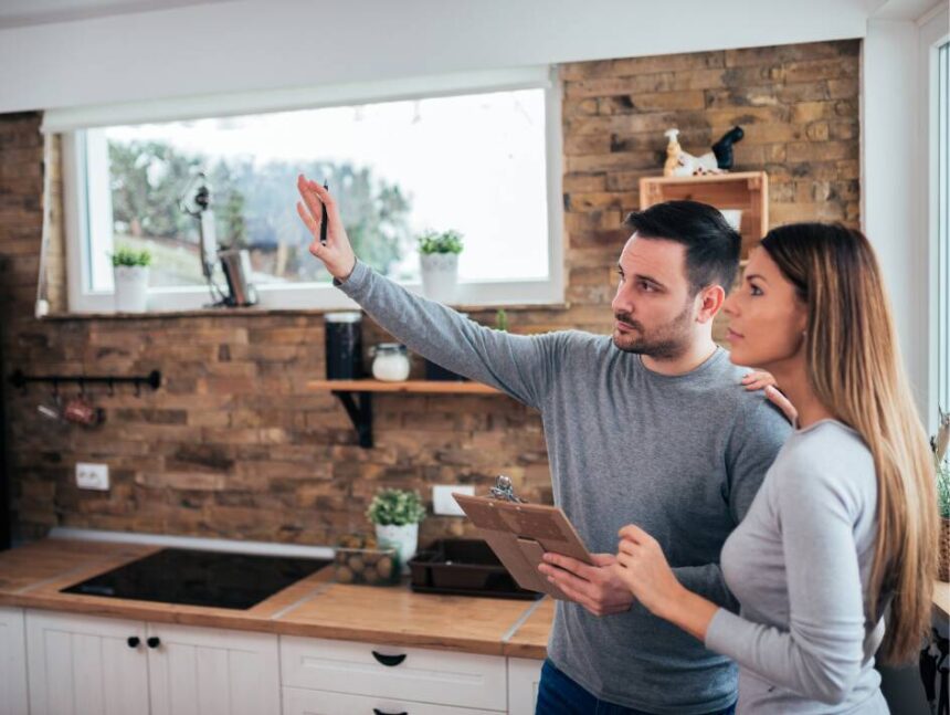 A couple discussing the costs of their Perth kitchen renovation