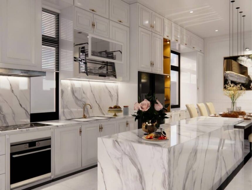 Luxurious kitchen with lots of marble and shaker style cabinets, after a kitchen renovation
