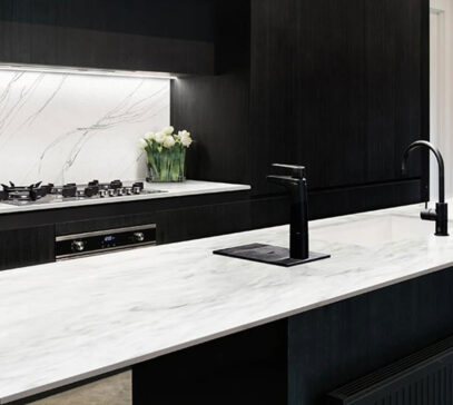 Contrasting black cabinetry and white marble bench in a luxury Perth kitchen
