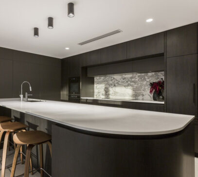 Luxury Perth kitchen with dark wood and marble tiles and backsplash