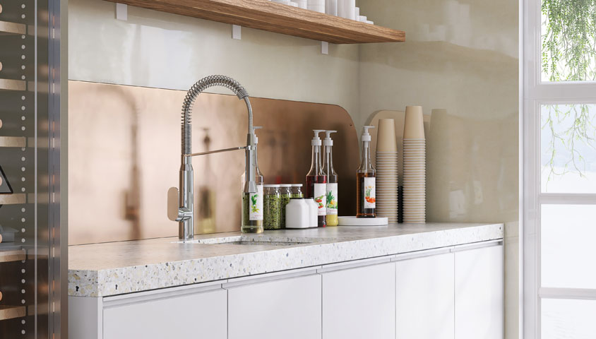 Kitchen renovation design with white speckled granite bench top, silver tap and complimenting gold backsplash