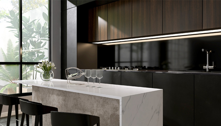 A modern kitchen island built in a recent kitchen island renovation with white marble and black cabinets