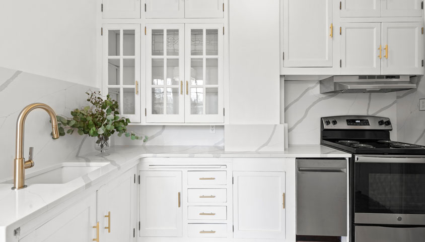 Feature image for How to Compare Kitchen Cabinets for Your Kitchen Renovation blog article with luxury white cabinets.